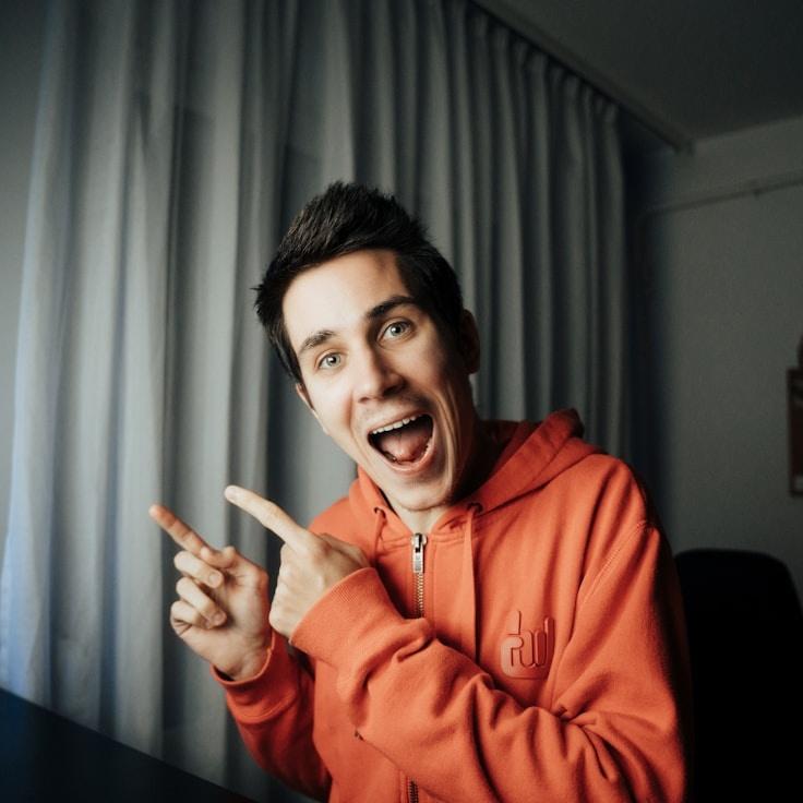 Alex Rivera, Lead Design Curator at LaterRidgeCanvas, reviewing corporate floral arrangements